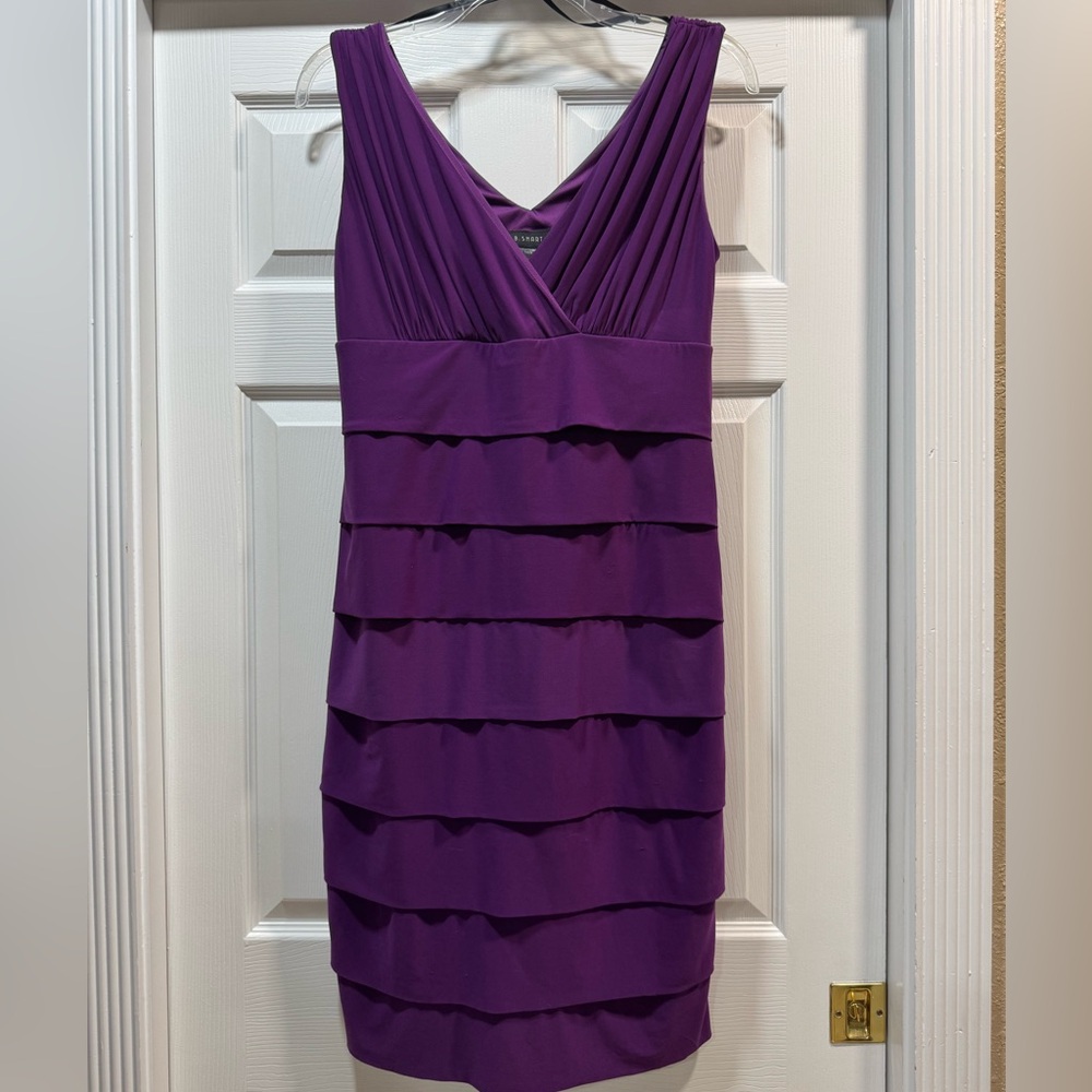 B. Smart brand V-neck with pleated front.